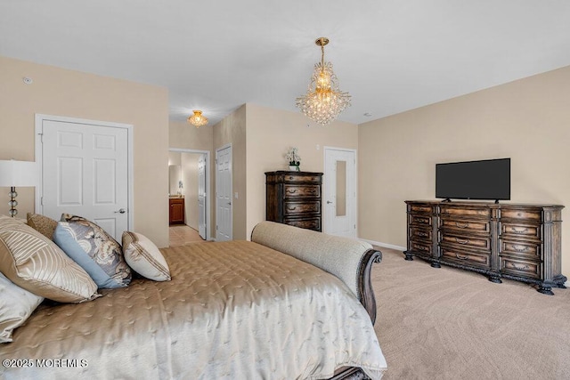 bedroom with baseboards, connected bathroom, an inviting chandelier, carpet flooring, and a closet