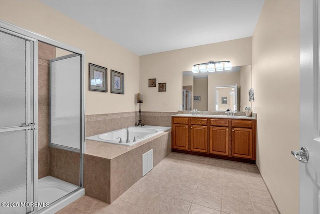 bathroom with double vanity, a stall shower, visible vents, tile patterned flooring, and a bath