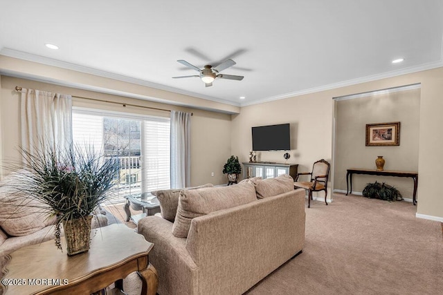 living area with ornamental molding, light carpet, ceiling fan, and baseboards