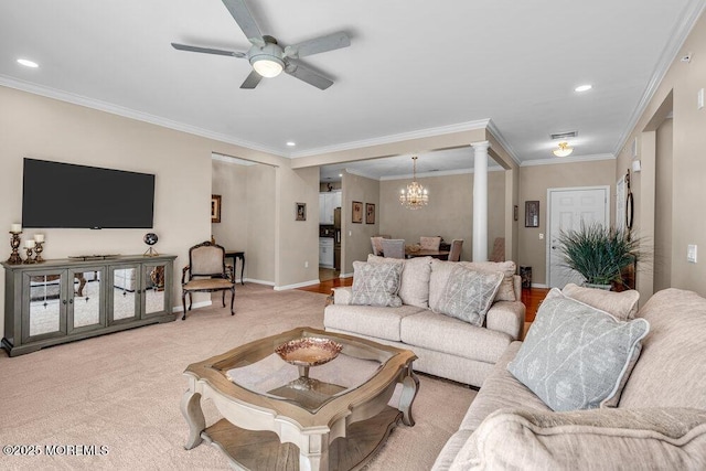 living room with ornamental molding, light colored carpet, baseboards, and ceiling fan with notable chandelier