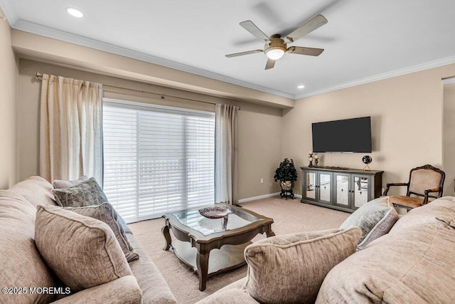 living room with baseboards, ornamental molding, a ceiling fan, and light colored carpet