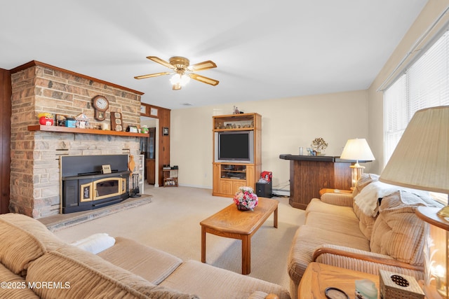 carpeted living area with a ceiling fan