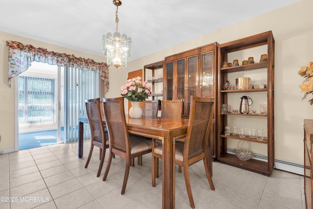 dining space featuring light tile patterned floors, baseboards, and an inviting chandelier