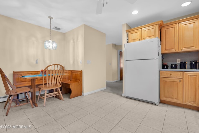 kitchen with recessed lighting, visible vents, hanging light fixtures, a ceiling fan, and freestanding refrigerator