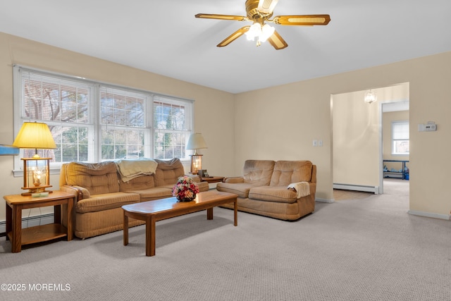 living room with ceiling fan, baseboards, baseboard heating, and carpet flooring