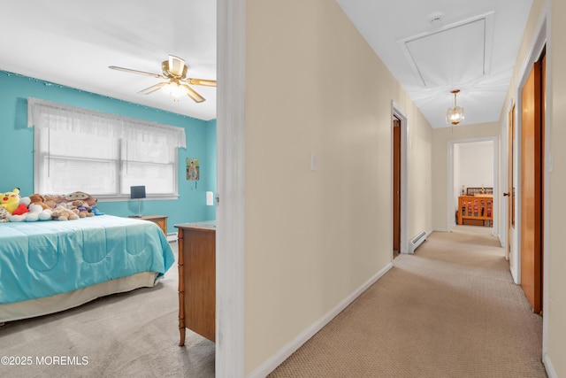 bedroom with light carpet, attic access, baseboards, ceiling fan, and a baseboard radiator