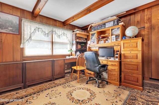 office featuring beam ceiling, built in study area, wooden walls, and baseboard heating