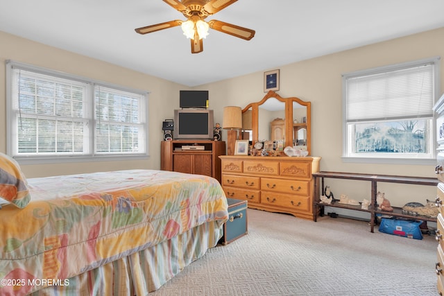 carpeted bedroom featuring a ceiling fan