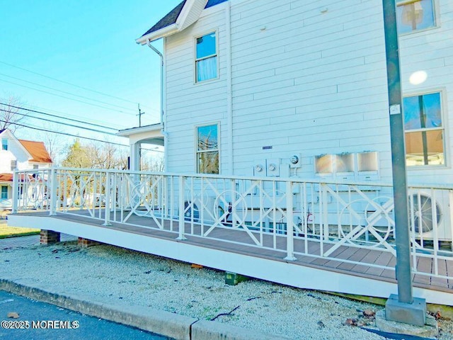 rear view of property with a wooden deck