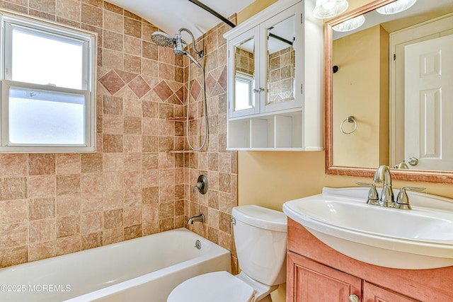 full bath featuring washtub / shower combination, vanity, and toilet