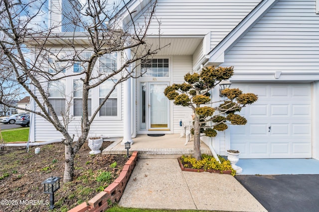 property entrance with aphalt driveway