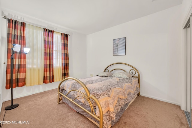 carpeted bedroom with baseboards