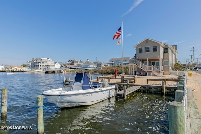 dock area with a water view and stairway