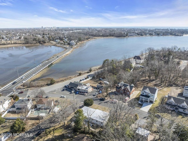 birds eye view of property featuring a water view