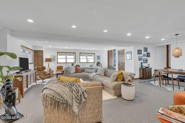 living room with recessed lighting and carpet floors