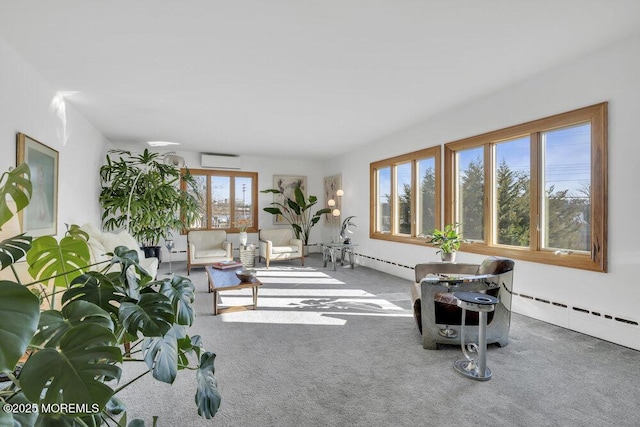 carpeted living room featuring a baseboard heating unit and a wall mounted air conditioner