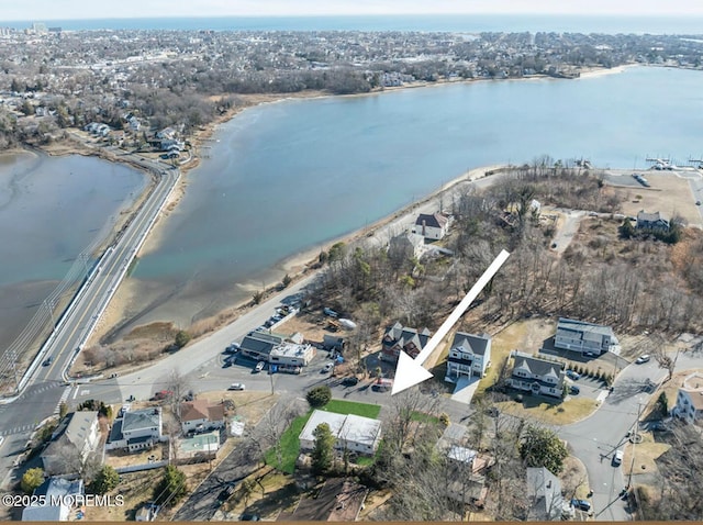 birds eye view of property with a water view