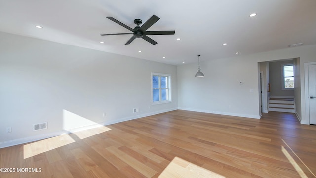 spare room with baseboards, recessed lighting, visible vents, and light wood-style floors