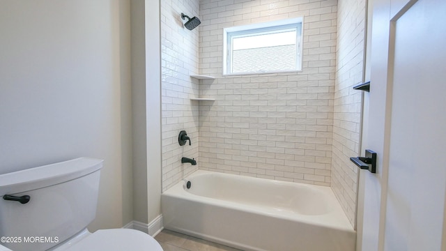 bathroom featuring  shower combination and toilet