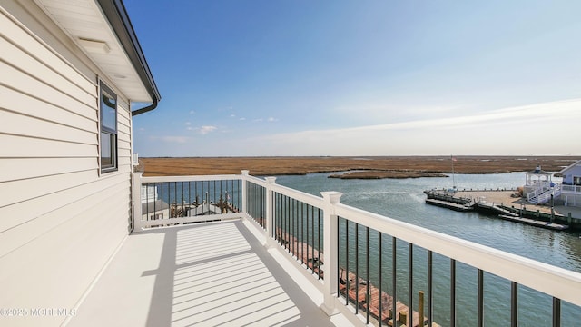 balcony featuring a water view
