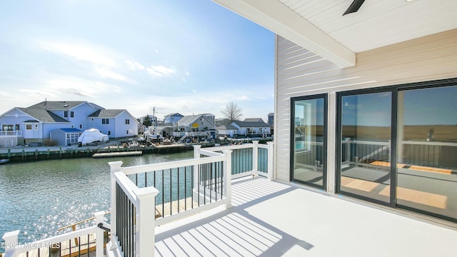balcony with a water view and a residential view