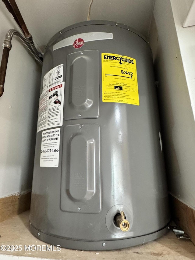 utility room featuring electric water heater