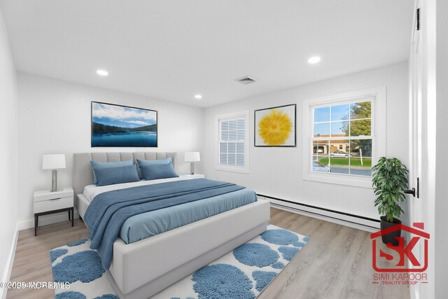 bedroom featuring baseboard heating, recessed lighting, visible vents, and wood finished floors