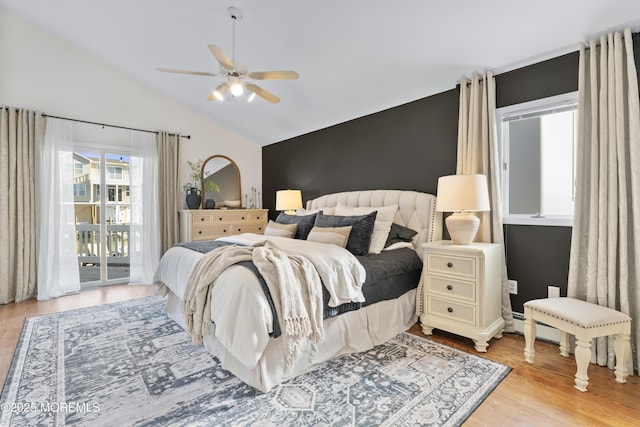 bedroom with vaulted ceiling, access to outside, ceiling fan, and light wood-type flooring