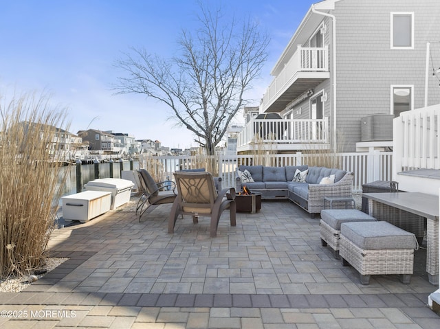 view of patio / terrace featuring a residential view, a balcony, and an outdoor living space