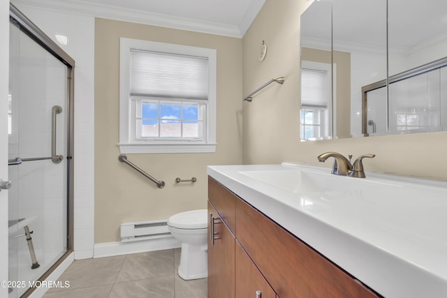 bathroom featuring ornamental molding, a wealth of natural light, toilet, and baseboard heating