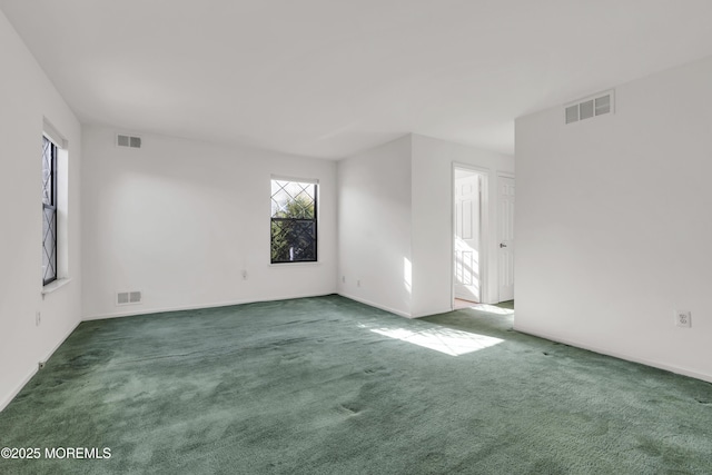 empty room with visible vents and carpet