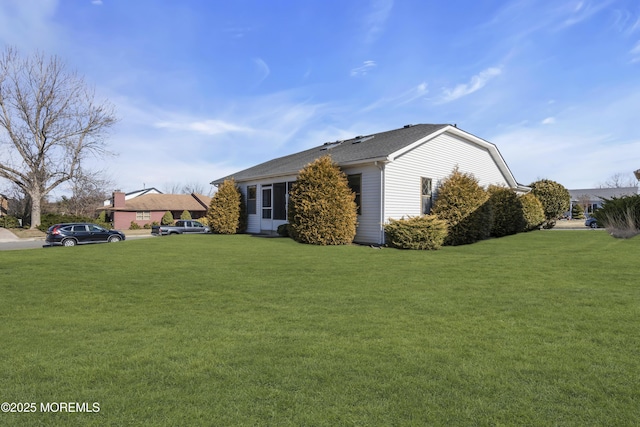 view of home's exterior featuring a lawn