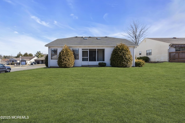 back of house with a yard