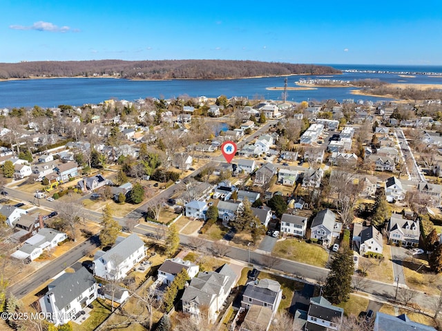 aerial view featuring a residential view and a water view