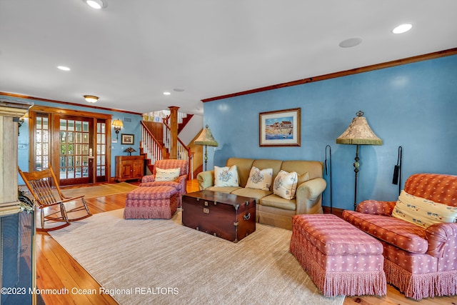 living area featuring stairs, recessed lighting, hardwood / wood-style flooring, and crown molding