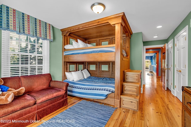 bedroom with recessed lighting and hardwood / wood-style floors