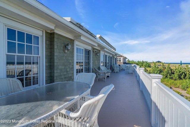 balcony featuring outdoor dining space