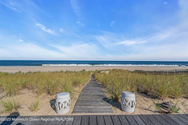 property view of water featuring a beach view