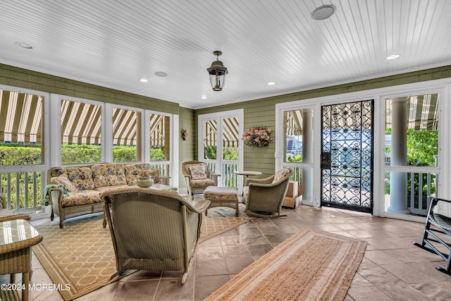 sunroom / solarium with plenty of natural light and wooden ceiling