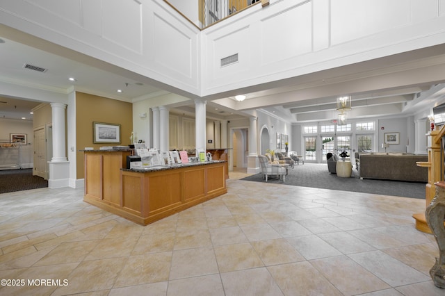 welcome area featuring french doors, visible vents, and ornate columns