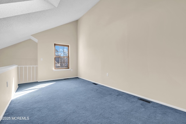 bonus room featuring baseboards, visible vents, lofted ceiling, a textured ceiling, and carpet floors