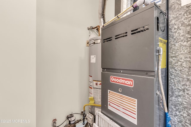 utility room featuring heating unit and gas water heater