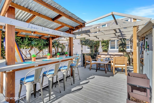 wooden deck featuring outdoor dry bar