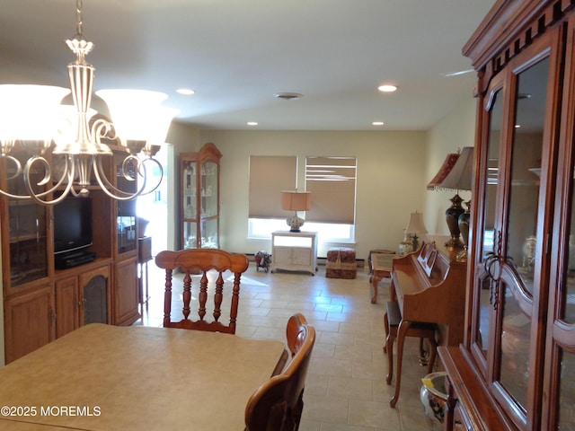 dining space featuring baseboards, recessed lighting, visible vents, and a notable chandelier