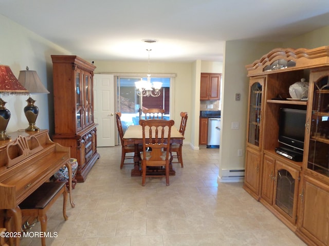 dining space with a baseboard radiator, visible vents, and a notable chandelier