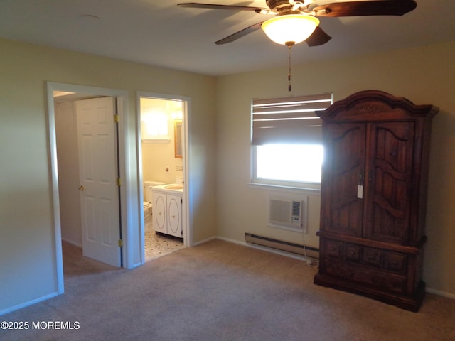 unfurnished bedroom with a baseboard radiator, a wall unit AC, connected bathroom, carpet floors, and washer and dryer