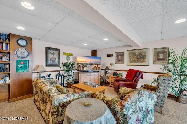 living room featuring recessed lighting, a paneled ceiling, and light carpet