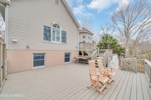 wooden deck featuring stairs