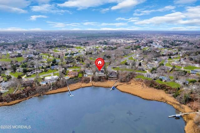 drone / aerial view featuring a residential view and a water view