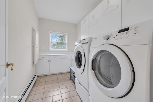 laundry area with light tile patterned flooring, washing machine and dryer, and baseboard heating
